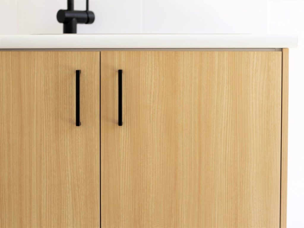 wooden cabinetw ith black handles