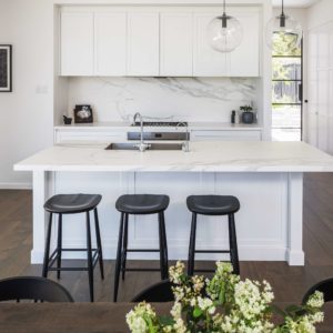 white kitchen island and stools