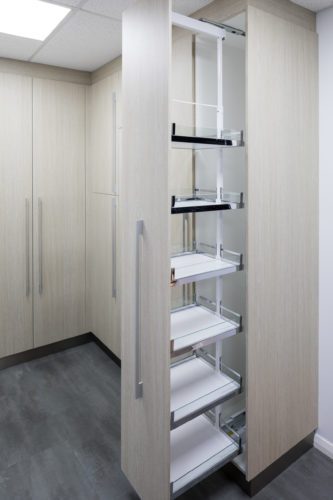 A floor to ceiling thin cupboard opening